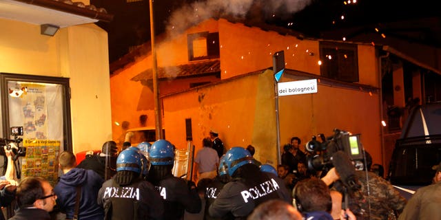 Oct. 15, 2013: Police in riot gear go after protesters after scuffles broke out outside the Society of St. Pius X, a schismatic Catholic group, where funeral of Nazi war criminal Erich Priebke was scheduled to take place, in Albano Laziale, on the outskirts of Rome.