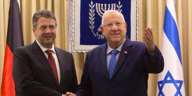 German Foreign Minister, Sigmar Gabriel, left, shakes hands with Israel's President, Reuven Rivlin during their meeting at the President's residence in Jerusalem, Tuesday, April 25, 2017. Gabriel said Tuesday it would be "regrettable" if Israeli Prime Minister Benjamin Netanyahu cancels their planned talks in Jerusalem because of his meeting with groups critical of Israel's actions in the West Bank, but downplayed the spat. (AP/Sebastian Scheiner)