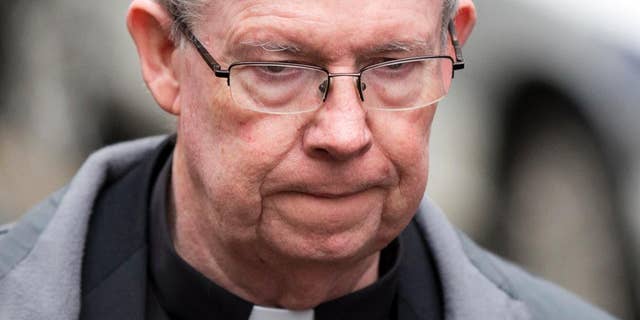 FILE - In this Jan. 6, 2014, file photo, Monsignor William Lynn walks from the criminal justice center after a bail hearing in Philadelphia. The Pennsylvania Supreme Court ruling Monday, April 27, 2015, upholds the 2012 conviction of Lynn over abuse committed by a diocesan priest years earlier. (AP Photo/Matt Rourke, File)