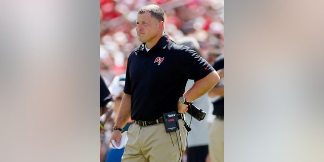 FILE - In this Sept. 29, 2013, file photo, Tampa Bay Buccaneers head coach Greg Schiano watches from the sideline during the second half of an NFL football game against the Arizona Cardinals in Tampa, Fla. Before Schiano became Tampa Bay's head coach, Chip Kelly turned down the Buccaneers. Kelly also turned down the Browns and Eagles a year later before changing his mind and leaving Oregon. When the Buccaneers and Eagles meet Sunday, the two coaches will be on opposite sidelines. (AP Photo/Reinhold Matay, File)