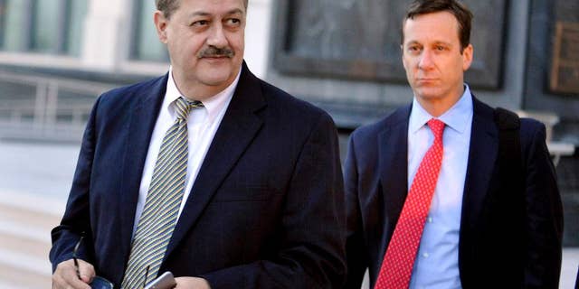 FILE - In a Tuesday, Nov. 24, 2015 file photo, former Massey Energy CEO Don Blankenship, left, walks out of the Robert C. Byrd U.S. Courthouse after the jury deliberated for a fifth full day in his trial, in Charleston, W.Va. A federal appeals court has affirmed the conviction of former Massey Energy CEO Don Blankenship in connection with the deadliest U.S. mine disaster in four decades. The 4th U.S. Circuit Court of Appeals handed down the opinion Thursday, Jan. 19, 2017, saying it found no reversible errors in trial rulings. (AP Photo/Chris Tilley, File)