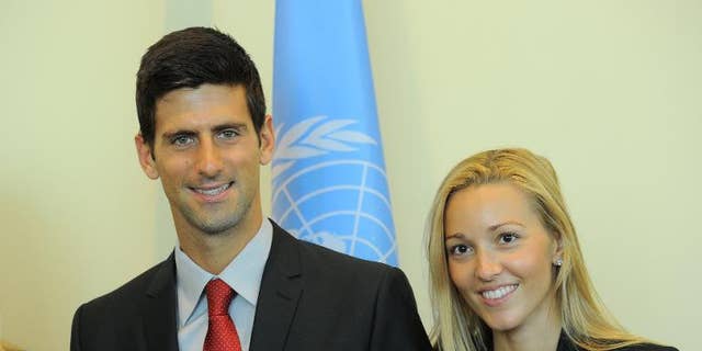 Serbian tennis player Novak Djokovic (L) and his girlfriend Jelena Ristic pose for a photo at the United Nations headquarters in New York, on August 23, 2013.
