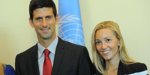 Serbian tennis player Novak Djokovic (L) and his girlfriend Jelena Ristic pose for a photo at the United Nations headquarters in New York, on August 23, 2013.
