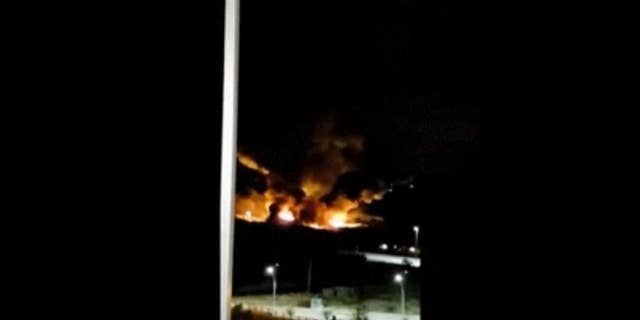 This image made from video shows the aftermath of an Israeli airstrike near a military airport west of Damascus, Syria on Friday, Jan. 13, 2016. Syria says Israel has launched missiles that hit near a military airport west of Damascus, triggering a fire. In a statement carried on the official news agency SANA, the military says the missiles were launched early on Friday and fell in the vicinity of the Mezzeh military airport. (Yomyat Kzefeh Hawen fi Dimashq via AP)
