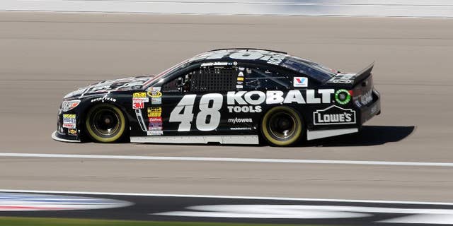 Jimmie Johnson drives during NASCAR Sprint Cup auto racing practice Friday, March 7, 2014, in Las Vegas. (AP Photo/Isaac Brekken)