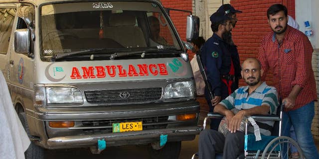 An ambulance that brought the body of a Spanish diplomat is parked at a clinic in Islamabad, Pakistan, Thursday, Oct. 13, 2016. Pakistani police say a Spanish diplomat has been found dead in his Islamabad home in what authorities suspect is a suicide. Police officer Iftikhar Chatha said Thursday that the 60-year-old man was found in his bedroom by a domestic servant. (AP Photo/B.K. Bangash)