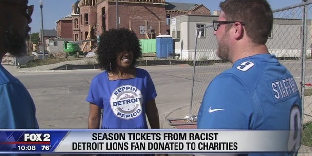 Lions fan and season ticketholder Stacey Graham (center) was happy to find out the Detroit Lions season tickets of a businessman who shamed her with a racial slur online would be given to charity.