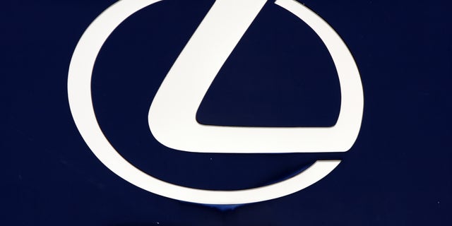 FILE - In this April 13, 2010 file photo, the Lexus logo is seen on a sign at a dealership in Portland, Maine. Toyota is recalling 907,000 vehicles, mostly Corolla models, around the world for faulty air bags and another 385,000 Lexus IS luxury cars for defective wipers. Toyota Motor Corp. spokesman Naoto Fuse said Wednesday, Jan. 30, 2013, there have been no accidents or injuries related to either of those defects, but the Japanese automaker received 46 reports of problems involving the air bags from North America, and one from Japan. There were 25 reports of problems related to the windshield wipers. (AP Photo/Pat Wellenbach, File)
