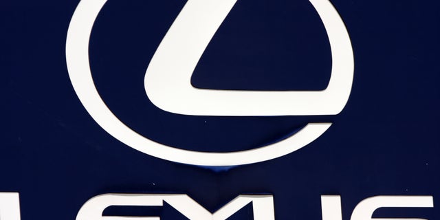 FILE - In this April 13, 2010 file photo, the Lexus logo is seen on a sign at a dealership in Portland, Maine. Toyota is recalling 907,000 vehicles, mostly Corolla models, around the world for faulty air bags and another 385,000 Lexus IS luxury cars for defective wipers. Toyota Motor Corp. spokesman Naoto Fuse said Wednesday, Jan. 30, 2013, there have been no accidents or injuries related to either of those defects, but the Japanese automaker received 46 reports of problems involving the air bags from North America, and one from Japan. There were 25 reports of problems related to the windshield wipers. (AP Photo/Pat Wellenbach, File)