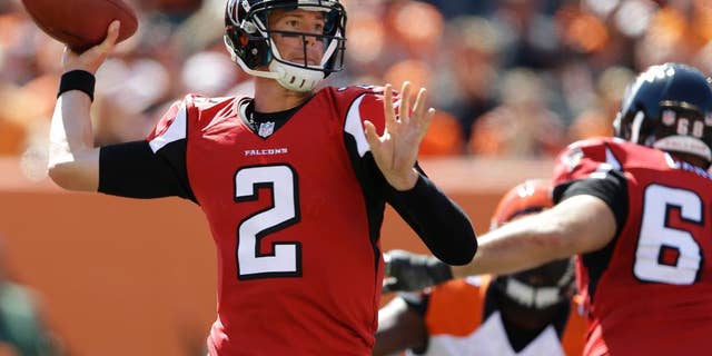 Atlanta Falcons quarterback Matt Ryan (2) passes against the Cincinnati Bengals in the second half of an NFL football game, Sunday, Sept. 14, 2014, in Cincinnati. (AP Photo/Michael Conroy)