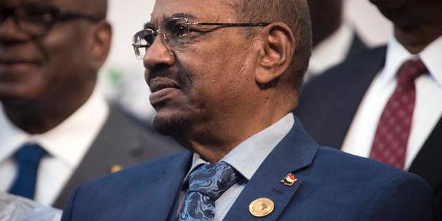FILE - In this June 14, 2015, file photo, Sudanese President Omar al-Bashir attends a photo session at the African Union summit in Johannesburg. South Africa has decided to withdraw from the International Criminal Court following a dispute over the visit by al-Bashir, who is wanted by the tribunal for alleged war crimes, crimes against humanity and genocide. (AP Photo/Shiraaz Mohamed, File)
