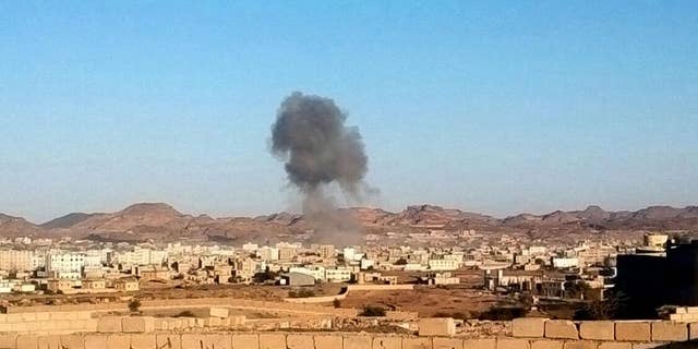 Smoke rises from the site of a car bomb explosion in Radda town,100 miles (160 kilometers) south of the capital Sanaa, Yemen, Tuesday, Dec. 16, 2014. Two suicide car bombers rammed their vehicles into a Shiite rebels’ checkpoint and a house south of the Yemeni capital Tuesday, as a school bus traveling nearby killing at least 25 dead including at least 15 primary school students, Defense Ministry, rebels and witnesses. (AP Photo)