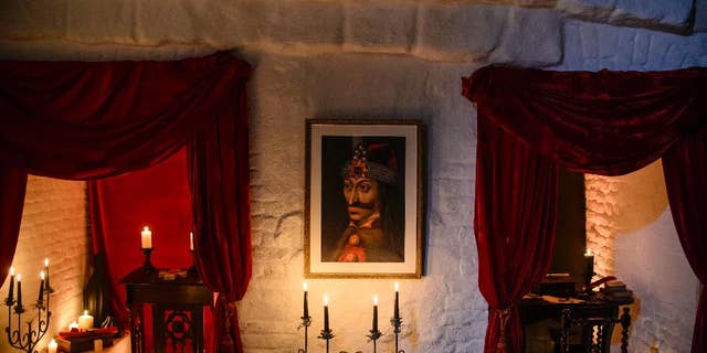 In this picture taken Oct. 9, 2016, a portrait of Vlad the Impaler is hung on a wall in Bran Castle, in Bran, Romania. (AP Photo/Andreea Alexandru)