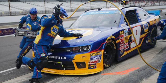 Chase Elliott makes a pit stop during the NASCAR Nationwide series auto race at Indianapolis Motor Speedway in Indianapolis, Saturday, July 26, 2014. (AP Photo/Robert Baker)
