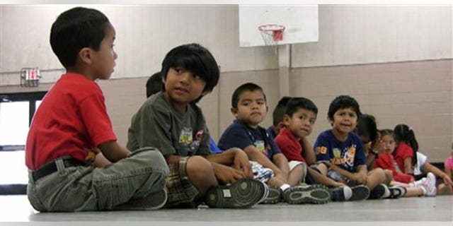 Aug 17: Students sit in the gym at Crossville Elmentary School in Crossville, Ala. In the last week, since Alabama enacted the nation's strictest state-level immigration law, growing numbers of Latino children of migrants have stayed away from school.