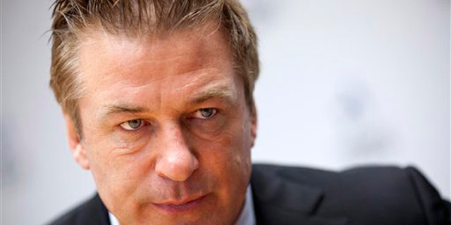 Alec Baldwin gestures during an interview with The Associated Press in Washington, Monday, April 16, 2012, Alec Baldwin is going to Congress to ask for sustained federal funding for arts programs amid the ever tight budget climate. (AP Photo/J. Scott Applewhite)