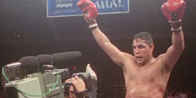 FILE - This June 22, 1996, file photo shows Hector "Macho" Camacho being lifted into the air after his unanimous decision over Roberto Duran in an IBC middleweight title fight at the Trump Taj Mahal Casino Resort in Atlantic City, N.J.