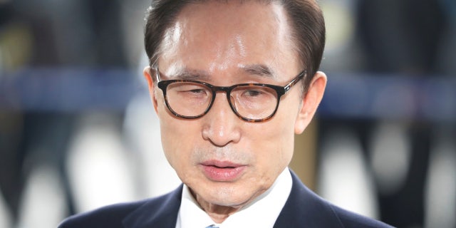 FILE: South Korea's former president Lee Myung-bak arrives at the prosecutors' office in Seoul.