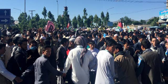 Hazara demonstrators gather to start marching toward the center of Kabul.