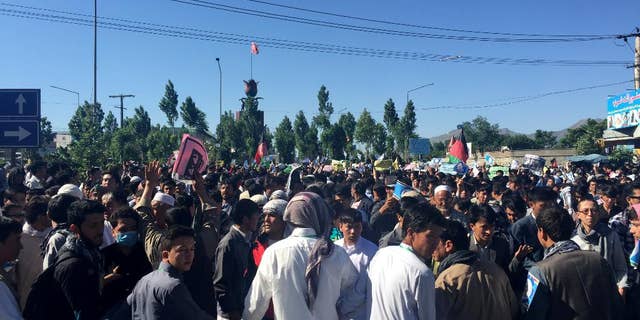 Hazara demonstrators gather to start marching toward the center of Kabul.