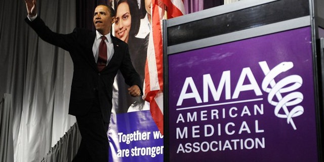 In this June 15, 2009, photo, President Obama arrives to deliver remarks on the health care system at the annual meeting of the American Medical Association in Chicago.