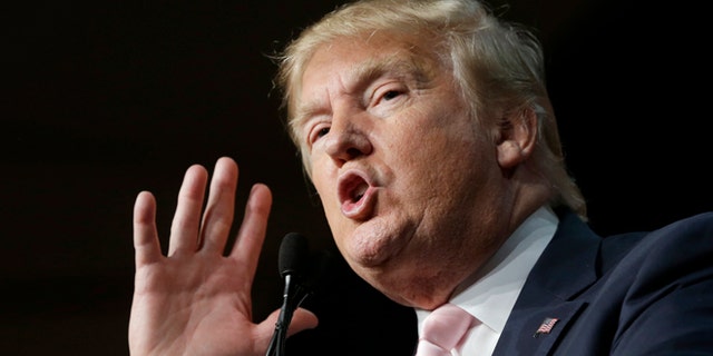 Republican presidential candidate Donald Trump gestures as he addresses supporters during a campaign stop at the Trump National Doral Miami resort, Friday, Oct. 23, 2015 in Doral, Fla. (AP Photo/Alan Diaz)