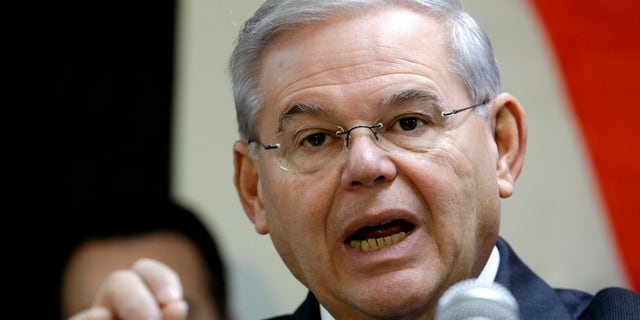 FILE - In this Dec. 5, 2014 file photo, Sen. Robert Menendez, D-N.J. speaks in Secaucus, N.J. Senate proponents of a bill empowering Congress to review and potentially reject any Iran nuclear deal must first win a battle with some colleagues determined to change the legislation in ways that could sink it. âAnybody who monkeys with this bill is going to run into a buzz saw,â Republican Sen. Lindsey Graham of South Carolina warned ahead of this weekâs debate. Also trying to discourage any changes, Democratic Sen. Bob Menendez of New Jersey urged senators to stick with the plan as it emerged from the Senate Foreign Relations Committee.  (AP Photo/Julio Cortez, File)