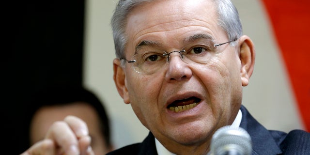 FILE - In this Dec. 5, 2014 file photo, Sen. Robert Menendez, D-N.J. speaks in Secaucus, N.J. Senate proponents of a bill empowering Congress to review and potentially reject any Iran nuclear deal must first win a battle with some colleagues determined to change the legislation in ways that could sink it. âAnybody who monkeys with this bill is going to run into a buzz saw,â Republican Sen. Lindsey Graham of South Carolina warned ahead of this weekâs debate. Also trying to discourage any changes, Democratic Sen. Bob Menendez of New Jersey urged senators to stick with the plan as it emerged from the Senate Foreign Relations Committee. (AP Photo/Julio Cortez, File)