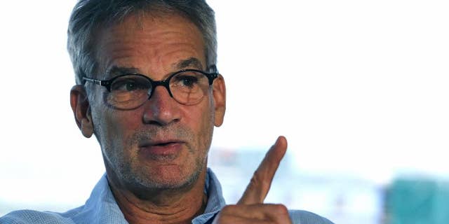 FILE - In this Sept. 17, 2014, file photo, Colorado-based author Jon Krakauer speaks during an interview, in Denver. Krakauer wrote the book, "Under the Banner of Heaven," about a Utah prison inmate serving a life sentence for killing his family. According to police, the inmate received letters from a woman who was found dead, along with her husband and three children, due to a drug overdose. (AP Photo/Brennan Linsley, File)