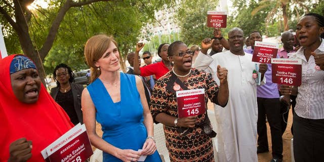 U.S. Ambassador to the United Nations Samantha Power stands between Aisha Yesufu, left, and Bring Back Our Girls co-founder Obiageli Ezekwesili during a vigil in Abuja, Nigeria, April 21, 2016.