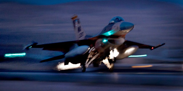 Oct. 30, 2012: An F-16 Fighting Falcon aircraft takes off for a night mission at Nellis Air Force Base, Nev. Air Force F-16 fighters, Civil Air Patrol aircraft and a U.S. Coast Guard MH-65 Dolphin helicopter will all participate in night exercises over Washington, D.C., in early December.