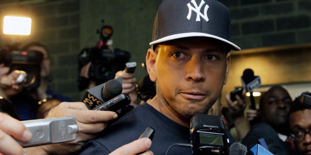FILE - in this April 1, 2013, file photo, New York Yankees' Alex Rodriguez talks to reporters outside the Yankees' clubhouse in New York. Injuries have kept him off the field for more than half the season and now A-Rod faces discipline from Major League Baseball in its drug investigation, possibly up to a lifetime ban. (AP Photo/Kathy Willens, File)