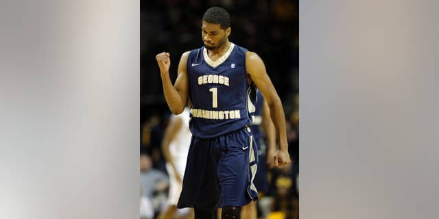 George Washington's Maurice Creek celebrates after his team scored during the first half of an NCAA college basketball game against VCU in the semifinal round of the Atlantic 10 Conference tournament at the Barclays Center in New York, Saturday, March 15, 2014. (AP Photo/Seth Wenig)