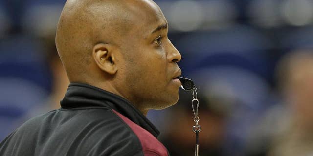 Virginia Tech head coach James Johnson watches during an NCAA college basketball practice at the Atlantic Coast Conference tournament in Greensboro, N.C., Tuesday, March 11, 2014. Virginia Tech plays Miami in a first round game on Wednesday. (AP Photo/Chuck Burton)