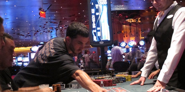 May 21, 2012: A dealer watches as gamblers place bets on a roulette table at Revel Casino Hotel in Atlantic City, N.J. Revel is one of three Atlantic City casinos that could close by September in a wave of casino contraction that could be a glimpse of the future for other parts of the country with too many casinos and not enough gamblers to support them. (AP/Wayne Parry)