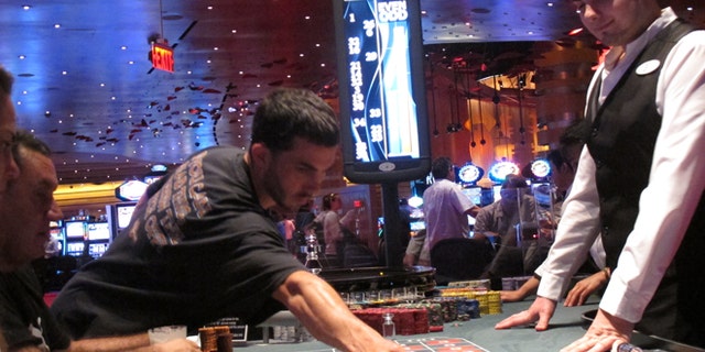May 21, 2012: A dealer watches as gamblers place bets on a roulette table at Revel Casino Hotel in Atlantic City, N.J. Revel is one of three Atlantic City casinos that could close by September in a wave of casino contraction that could be a glimpse of the future for other parts of the country with too many casinos and not enough gamblers to support them. (AP/Wayne Parry)