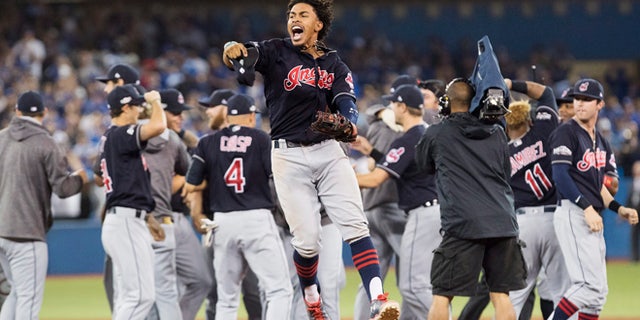Cleveland Indians shortstop Francisco Lindor celebrates after the Indians defeated the Toronto Blue Jays 3-0 Game 5 of the baseball American League Championship Series in Toronto on Wednesday, Oct. 19, 2016. (Mark Blinch/The Canadian Press via AP)