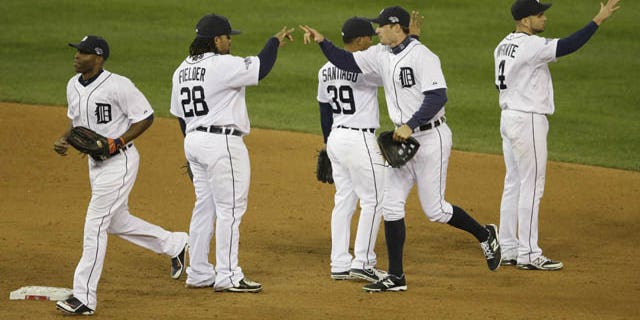 October 16, 2013: The Detroit Tigers players celebrate after Game 4 of the American League baseball championship series against the Boston Red Sox Wednesday in Detroit. The Tigers won 7-3. (AP Photo/Carlos Osorio)
