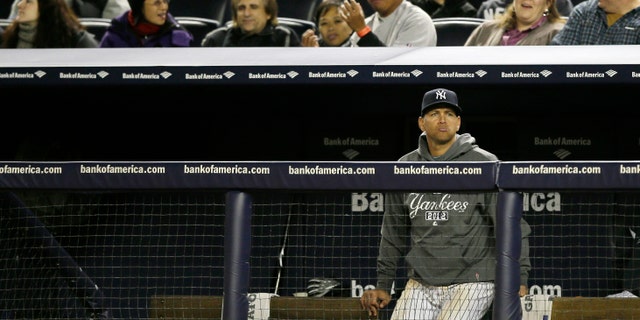Oct. 13, 2012: New York Yankees' Alex Rodriguez watches from the bench in the ninth inning of Game 1 of the American League championship series against the Detroit Tigers in New York.