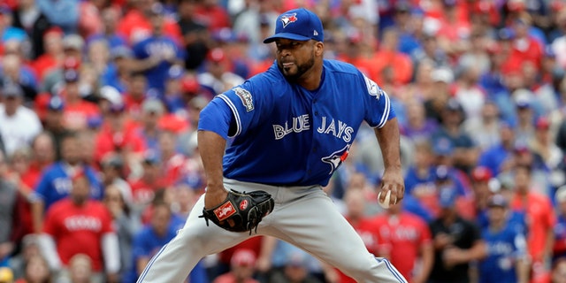 Toronto Blue Jays relief pitcher Francisco Liriano throws against the Texas Rangers in the eighth inning of Game 2 of baseball's American League Division Series, Friday, Oct. 7, 2016, in Arlington, Texas. (AP Photo/David J. Phillip)