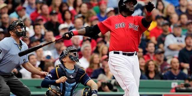 Boston Red Sox designated hitter David Ortiz, right, watches his ground rule double in front of Tampa Bay Rays catcher Jose Lobaton in the fourth inning in Game 1 of baseball's American League division series, Friday, Oct. 4, 2013, in Boston. (AP Photo/Charles Krupa)
