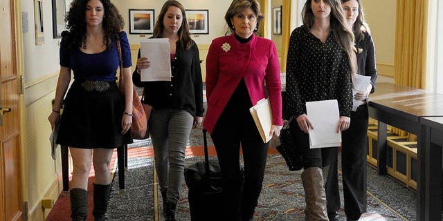 Oct. 21: Attorney Gloria Allred, center, walks with University of Connecticut students Rose Richi, left, Erica Daniels, Carolyn Luby, second from right, and Kylie Angell, right, to a news conference in Hartford.