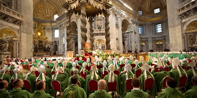 Pope Francis celebrates a Mass to mark the end of the Synod of bishops at the Vatican Sunday. (AP Photo/Alessandra Tarantino)