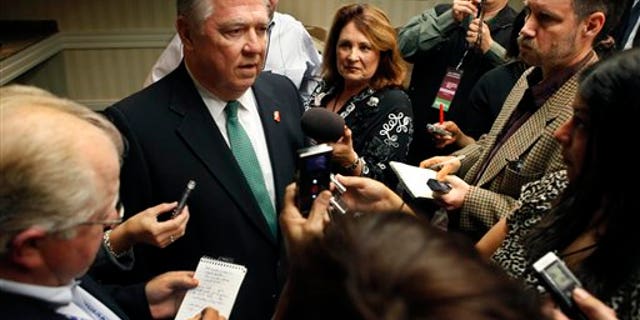 Barbour talks with reporters during the California Republican Convention in Sacramento, Calif., Saturday. (AP)