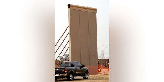A border wall prototype stands near the border with Tijuana, Mexico, Thursday, Oct. 19, 2017, in San Diego. Companies are nearing an Oct. 26 deadline to finish building eight prototypes of President Donald Trump's proposed border wall with Mexico. (AP Photo/Gregory Bull)