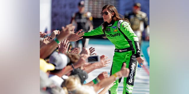 Danica Patrick greets fans as she is introduced before the NASCAR Daytona 500 Cup series auto race at Daytona International Speedway in Daytona Beach, Fla., Sunday, Feb. 18, 2018.