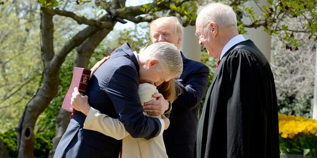 Justice of the Supreme Court Neil Gorsuch hugs his wife Louise during a ceremony at the White House Rose Garden April 10, 2017.Photo by Olivier Douliery/ Abaca(Sipa via AP Images)