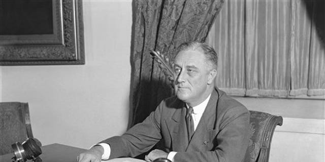 President Franklin D. Roosevelt at his desk in the White House, May 7, 1933.