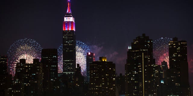 Fireworks are shown lighting up the Empire State Building along the Manhattan skyline during Macy's 37th Annual Fourth of July fireworks show on July 4, 2013, in New York. 