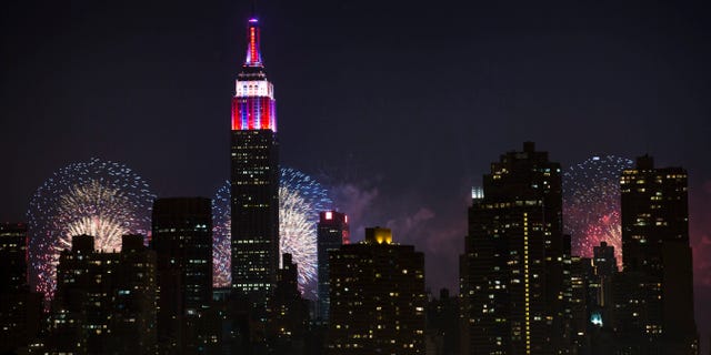 Fireworks are shown lighting up the Empire State Building along the Manhattan skyline during Macy's 37th Annual Fourth of July fireworks show on July 4, 2013, in New York. 